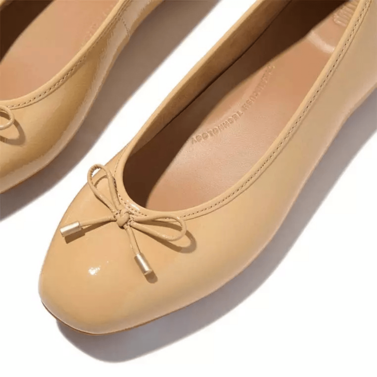 FitFlop Women's Delicato Bow Cappuccino Textured Patent Leather - 9031953 - Tip Top Shoes of New York